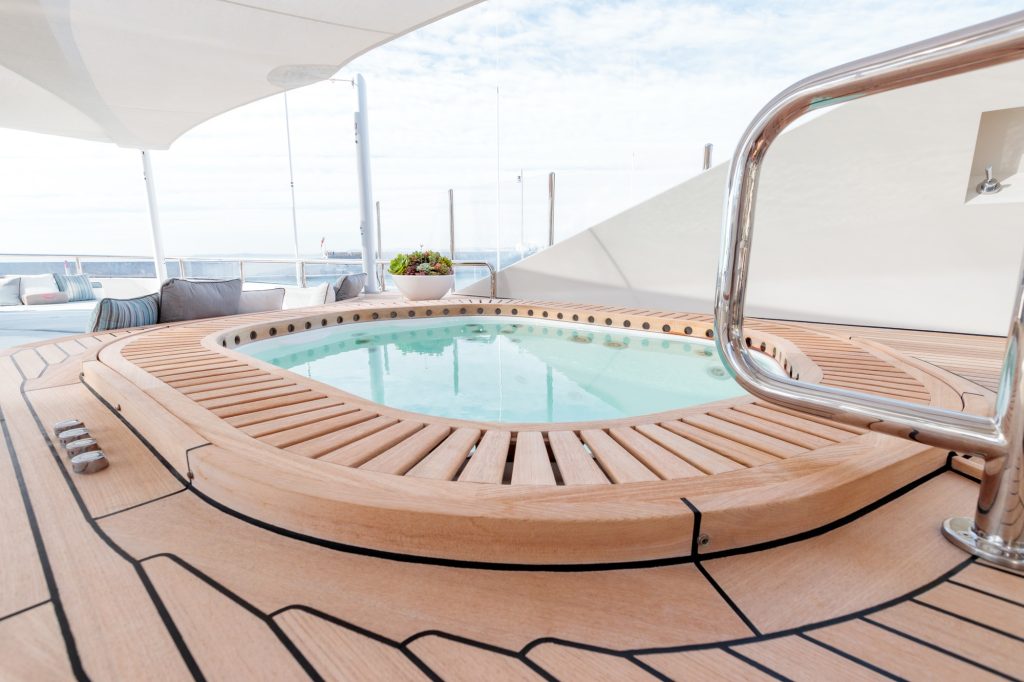 Pool on a yacht with a cloudy sky in the background